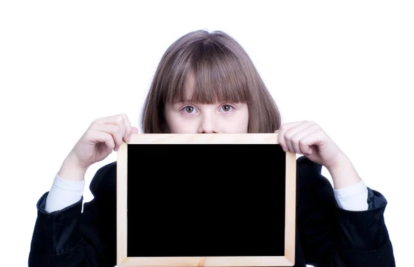 Adolescente menina da escola com uma placa preta — Fotografia de Stock