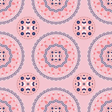 Etnik çiçek süsü. Pembe arka planda soyut çiçekleri olan kusursuz desen