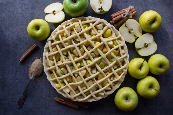 Beautiful decorated apple pie. Holiday menu ideas. Classic apple pie receipt. Apple pie top view photo.  Homemade apple pie top view photo.Delicious apple tart or pie on a table. Autumn menu ideas. Healthy eating concept.