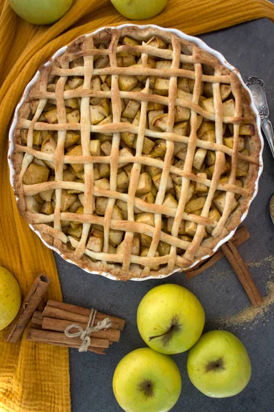 Beautiful decorated apple pie. Holiday menu ideas. Classic apple pie receipt. Apple pie top view photo.  Homemade apple pie top view photo.Delicious apple tart or pie on a table. Autumn menu ideas. Healthy eating concept.