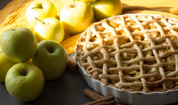 Apple pie top view photo.  Homemade apple pie top view photo.Delicious apple tart or pie on a table. Autumn menu ideas. Healthy eating concept.