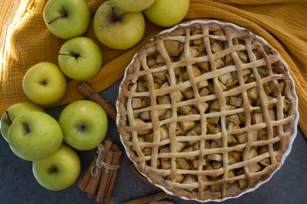 Apple pie top view photo.  Homemade apple pie top view photo.Delicious apple tart or pie on a table. Autumn menu ideas. Healthy eating concept.