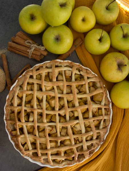 Apple pie top view photo.  Homemade apple pie top view photo.Delicious apple tart or pie on a table. Autumn menu ideas. Healthy eating concept.