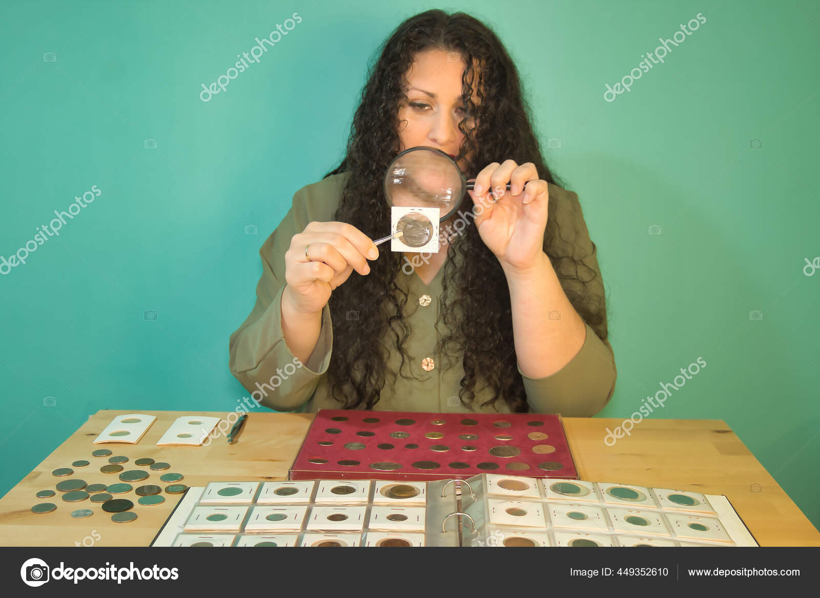 Woman Looks Coins Magnifying Glas Stock Photo by ©Liubomyr
