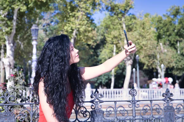 Middle Aged Adult Hispanic Woman Black Curly Hair Taking Photo — Stock Photo, Image