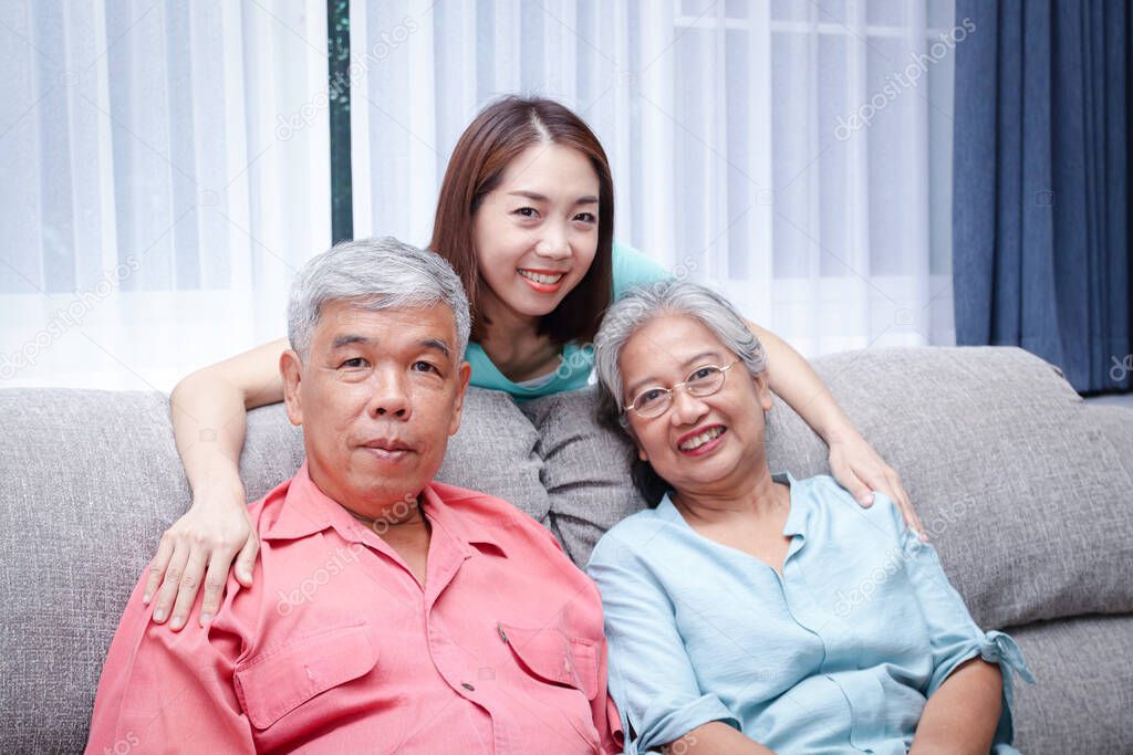 Asian family The daughter takes care of the elderly parents to be happy. Concept of health care Living in retirement