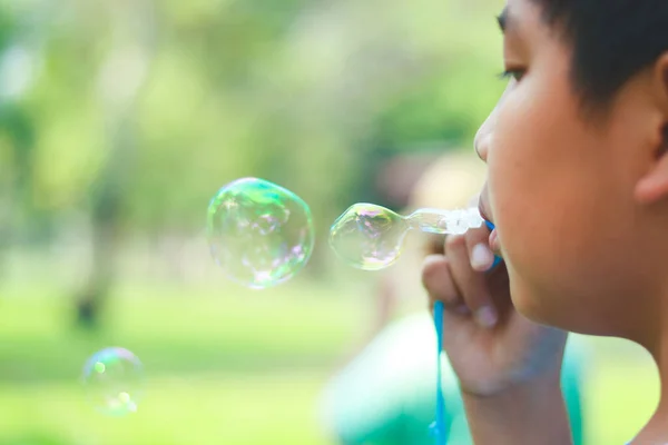 Asian Boy Playing Blowing Bubbles Park Stock Image