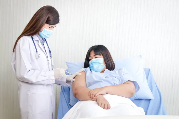 Female Doctor Injects Antiviral Vaccine Obese Woman Patient Put Mask — 스톡 사진