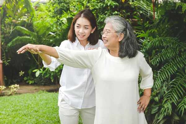 Asian Elderly Woman Doing Physical Therapy Has Daughter Help Support — Stock Photo, Image