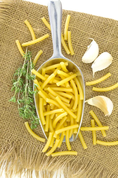 Pile Uncooked Pasta Herbs Garlic Cloth — Stock Photo, Image