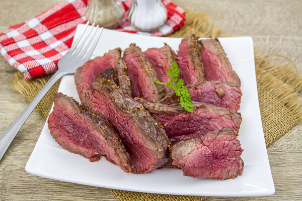 Beef steak with spices on a plate