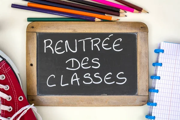 slate with writing in French back to school