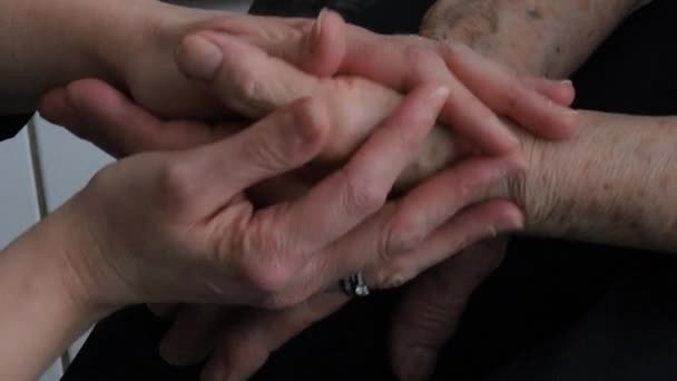 Young Woman Holding Senior Woman Hands Closeup — Stock Video