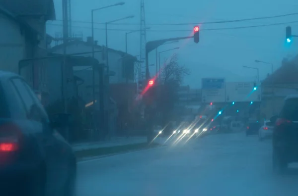 bad weather conditions and poor visibility in road traffic on a rainy day