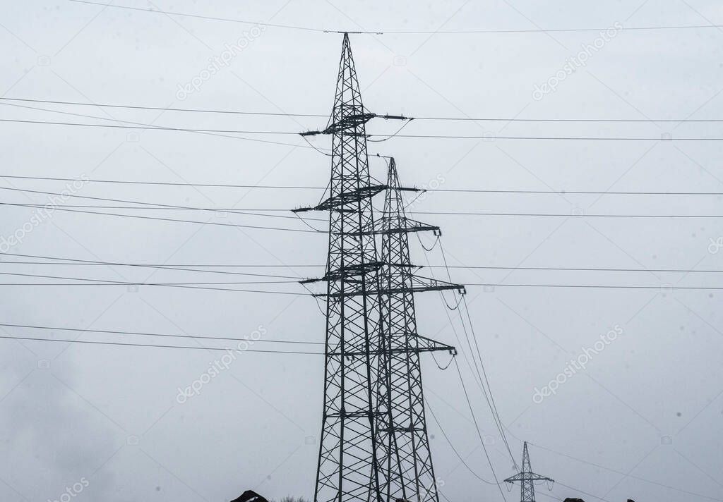 energy supply with a 380 kv power line and power pole in winter