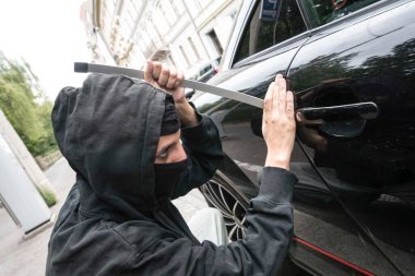breaking into a car, car theft and stealing as a criminal offense clipart