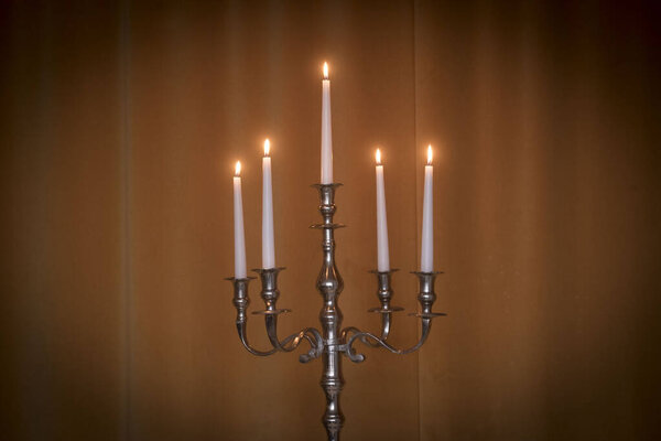 an atmospheric and warm light from candle, candles for festive lightning