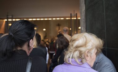 people mourning after someone died in a church at a funeral service clipart