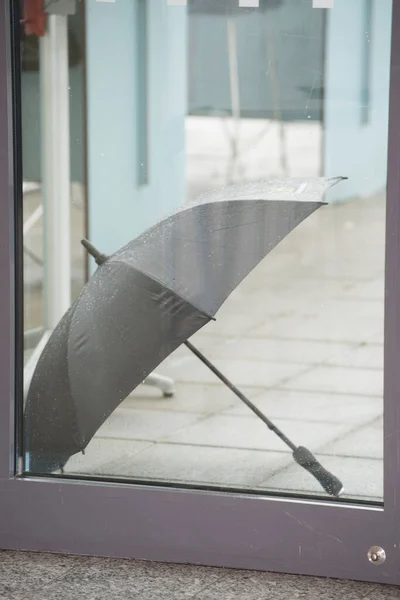 an umbrella as a protection against rain on the outside