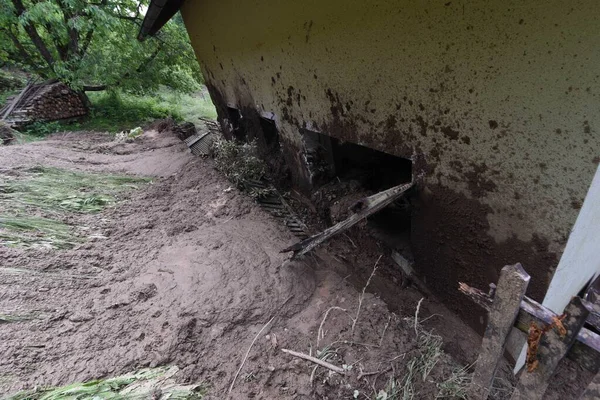 storm damage caused by mudslides, debris and mud after heavy rainfalls