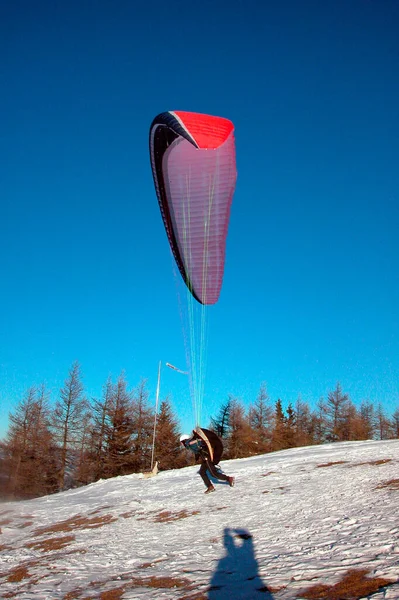 paragliding in the alps in winter, outdoor sports in the mountains