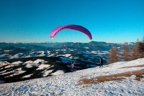 paragliding in the alps in winter, outdoor sports in the mountains