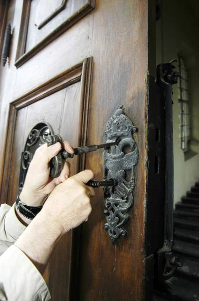 an old or antique door lock for opening and locking a door