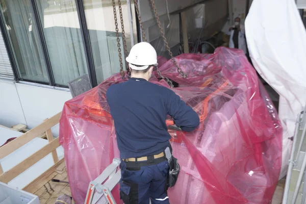 the assembly and mounting of industrial equipment by industry worker