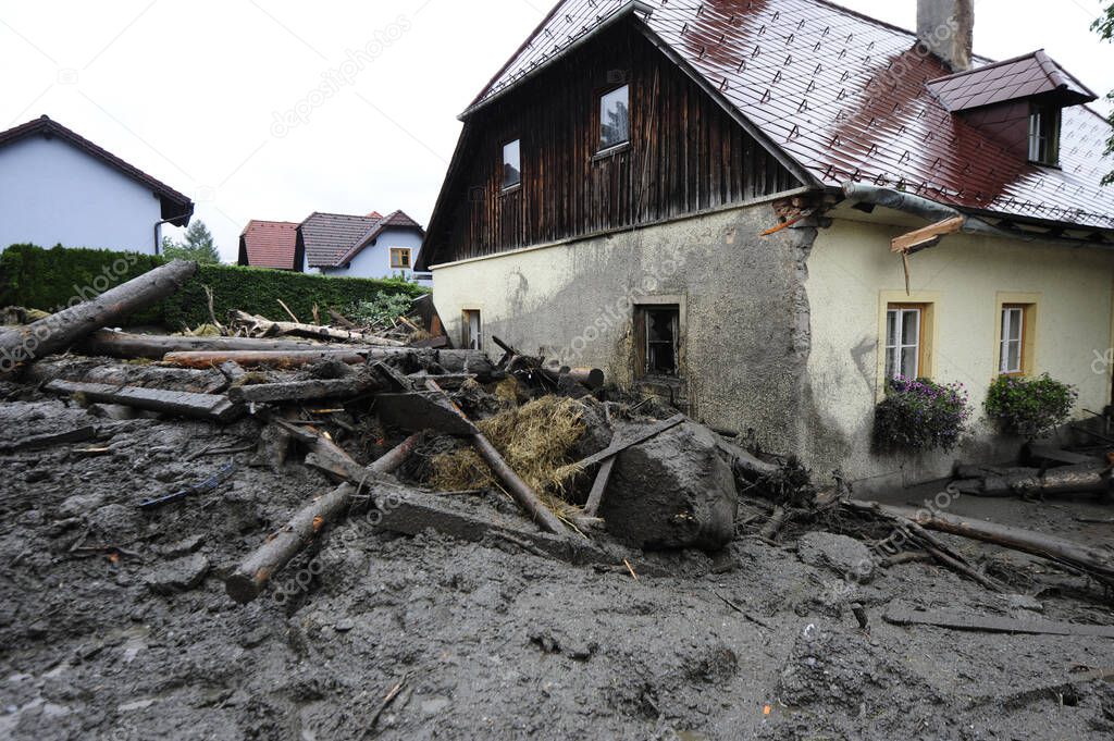 building in a flooded area after heavy rainfalls, muddy water