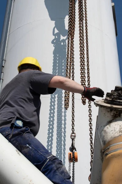 the assembly and mounting of industrial equipment by industry worker