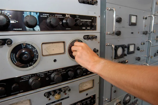 in an analog control room, controlling machines and working processes