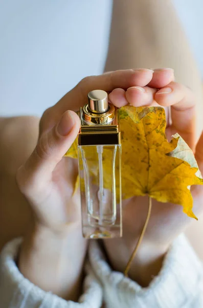 Woman Holding Bottle Perfume Yellow Autumn Leaf Her Hands — Stock Photo, Image