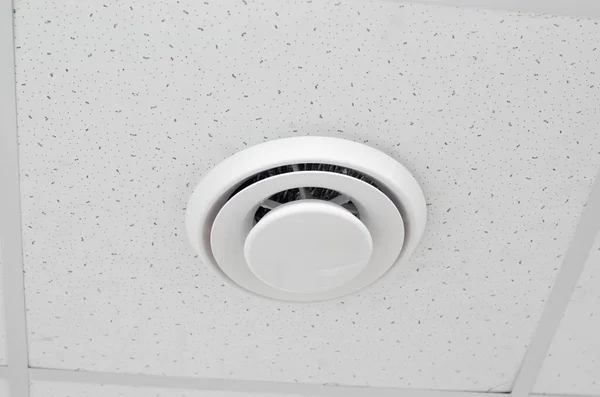 Modern ventilation built into the ceiling. Round ventilation duct on the ceiling