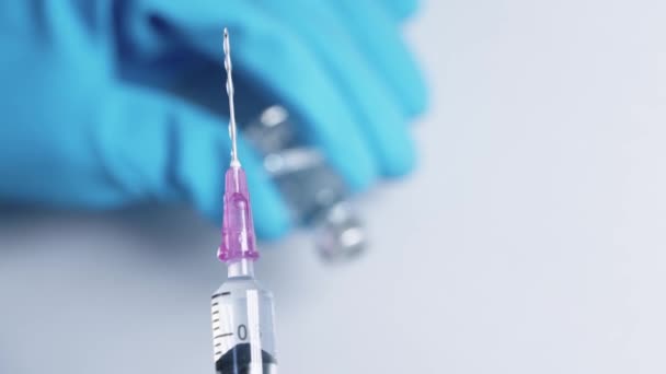 Close Shot Transparent Liquid Vaccines Being Vertical Pouring Out Syringe — Stock Video