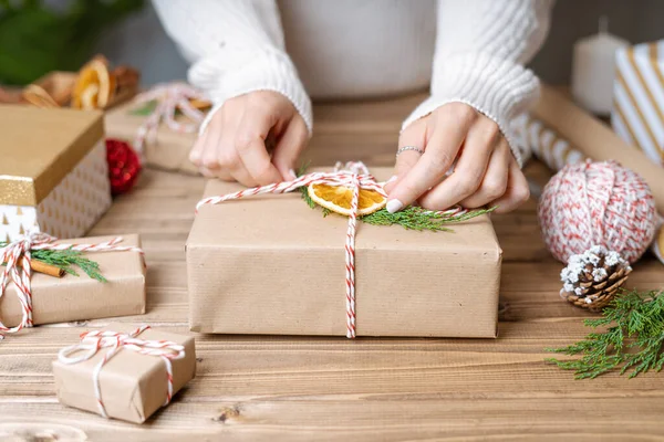 Woman Hands Wrapping Christmas Gift Close Unprepared Presents Wooden Background — Stock Photo, Image