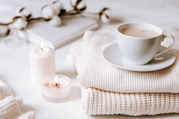 White cup of coffee, cotton, candles. — Stock Photo, Image