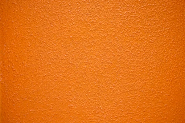 Saturated intensive orange textured surface.