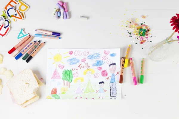 Kids drawing of multi-racial Family and colored pencils on woode — Stock Photo, Image