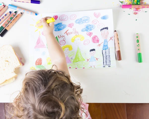 Little girl painting a sun in a kids drawing of multi-racial Fam — Stock Photo, Image