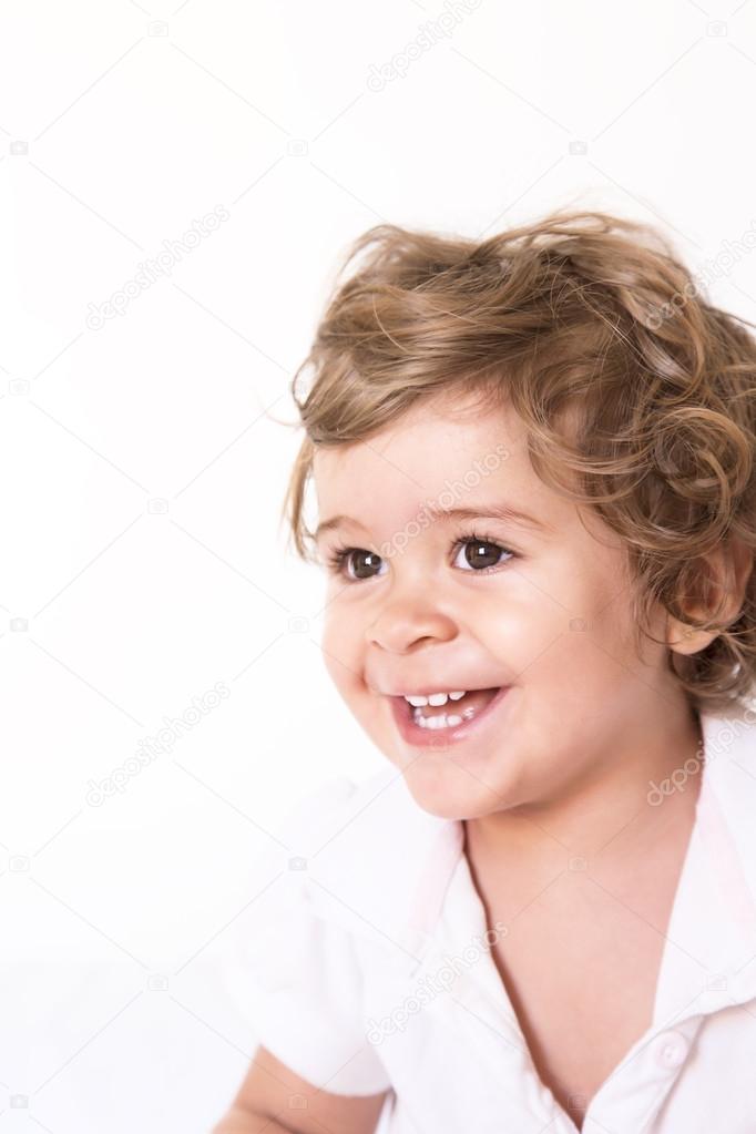 Portrait of a cute baby girl smiling isolated on white