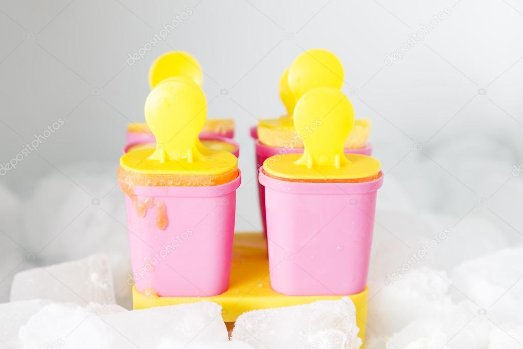 Close Up of six homemade ice creams in fridge with ice blocks