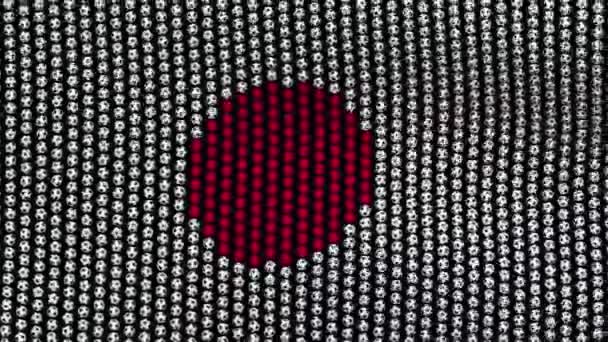 Drapeau du Japon, composé de nombreuses boules flottant dans le vent, sur un écran noir . — Video