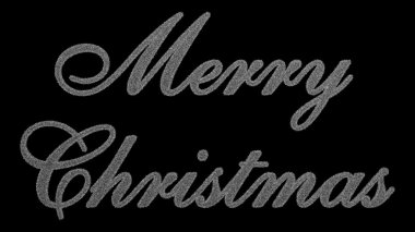 Kar taneleri siyah bir arka plan üzerinde oluşan neşeli Noel yazıt