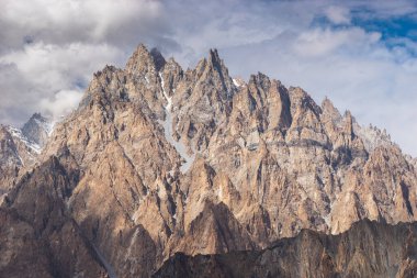 Passu cathedral mountains massif in cloudy day, Karakoram mountains range in north Pakistan, Asia