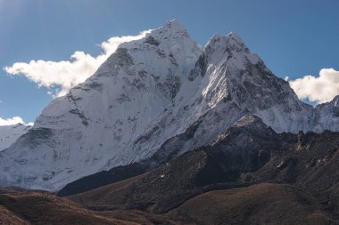 Ama Dablam mountain peak view from Dingboche village, Everest base camp trekking route, Himalaya mountains range in Nepal, Asia