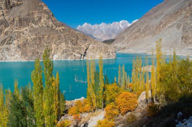Attabad lake in a beautiful autumn season with Passu cathedral mountains massif in background, Karakoram mountains range in Pakistan, Asia clipart