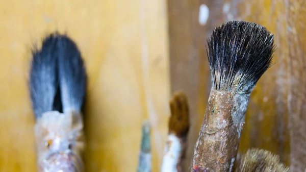 Set of old brushes in the artist's workshop