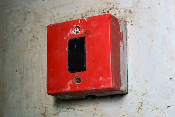 Old Red Light Switch Wall Stock Photo