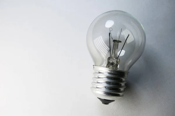 Non-working incandescent light bulb on a white background