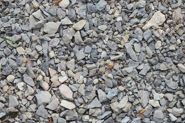 浅色花岗岩石堆在地上作为背景 — 图库照片